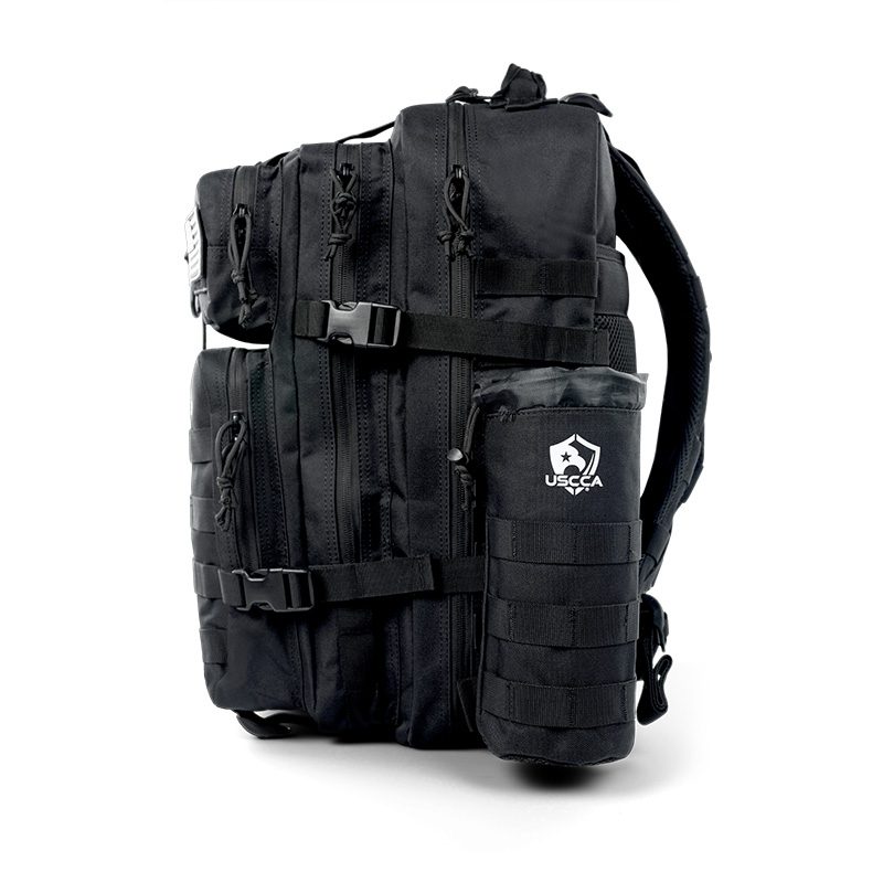https://store.usconcealedcarry.com/wp-content/uploads/2023/03/uscca-tactical-water-bottle-pouch-black-black-on-backpack.jpg